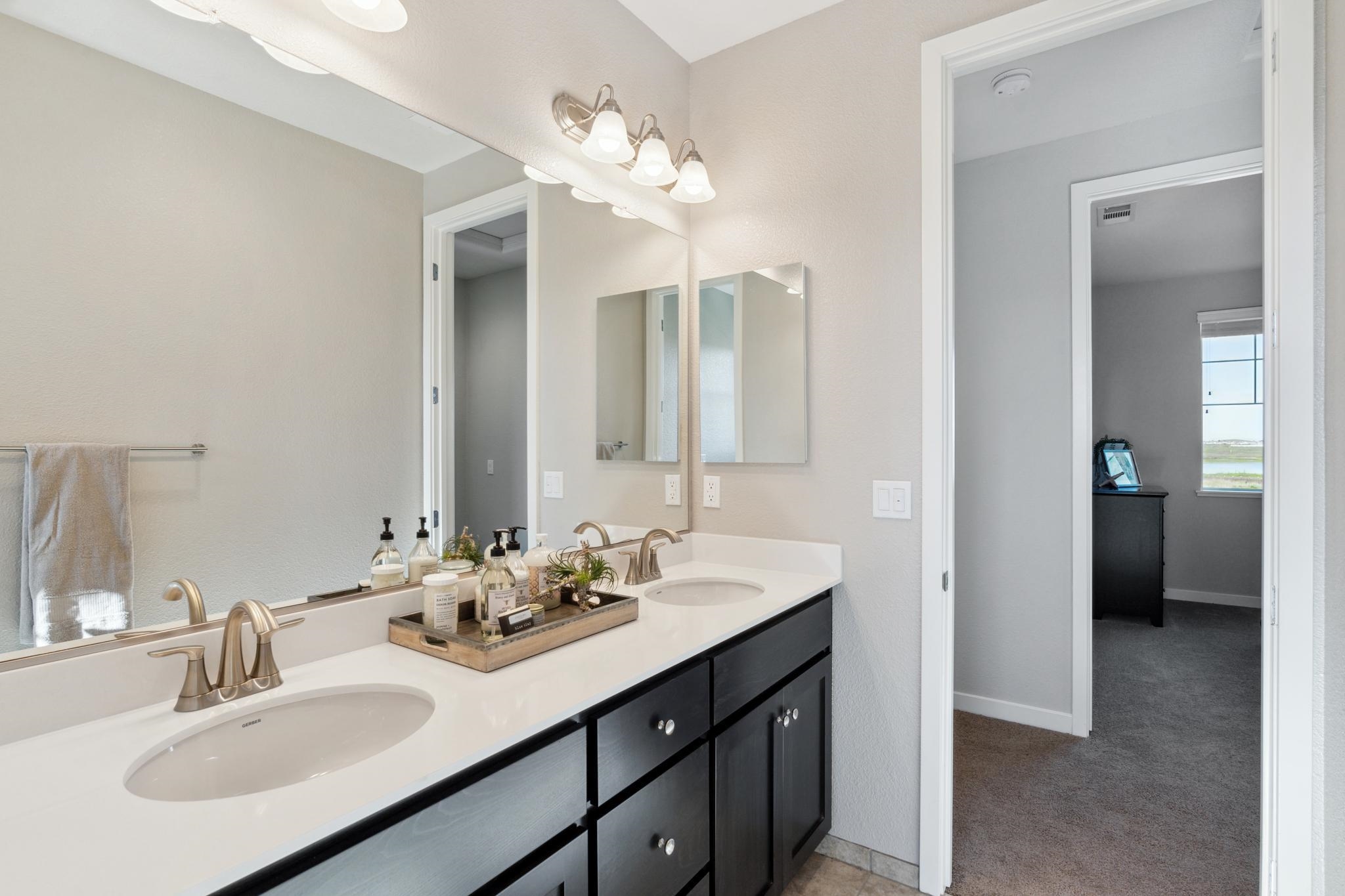 1476 Monument Lane Fairfield, CA 94533 - Photo 19 of 21 a bathroom with a sink double vanity and a mirror