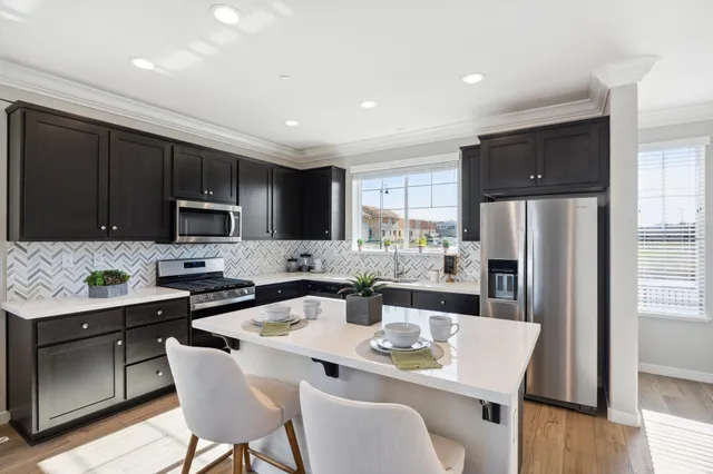 a kitchen with a sink stove and cabinets