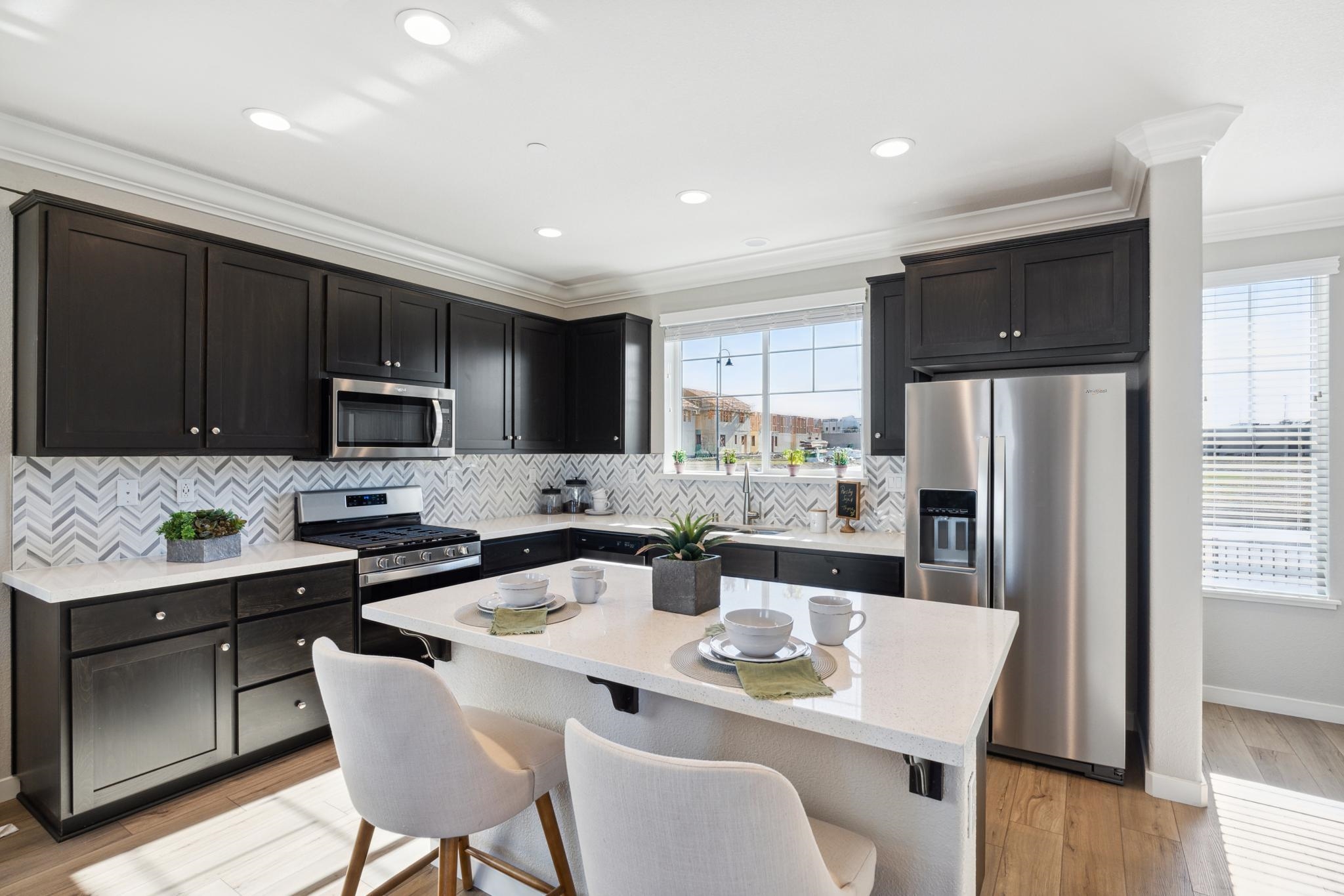 1476 Monument Lane Fairfield, CA 94533 - Photo 3 of 21 a kitchen with stainless steel appliances granite countertop a refrigerator a stove microwave cabinets and chairs