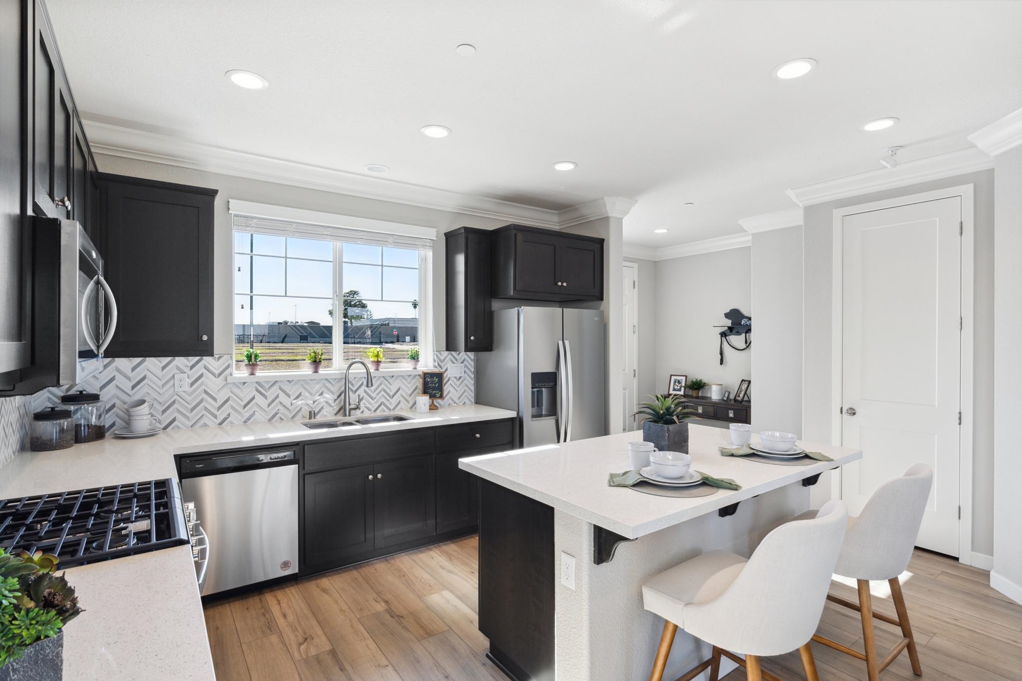 1476 Monument Lane Fairfield, CA 94533 - Photo 4 of 21 a kitchen with stainless steel appliances kitchen island granite countertop a sink and cabinets
