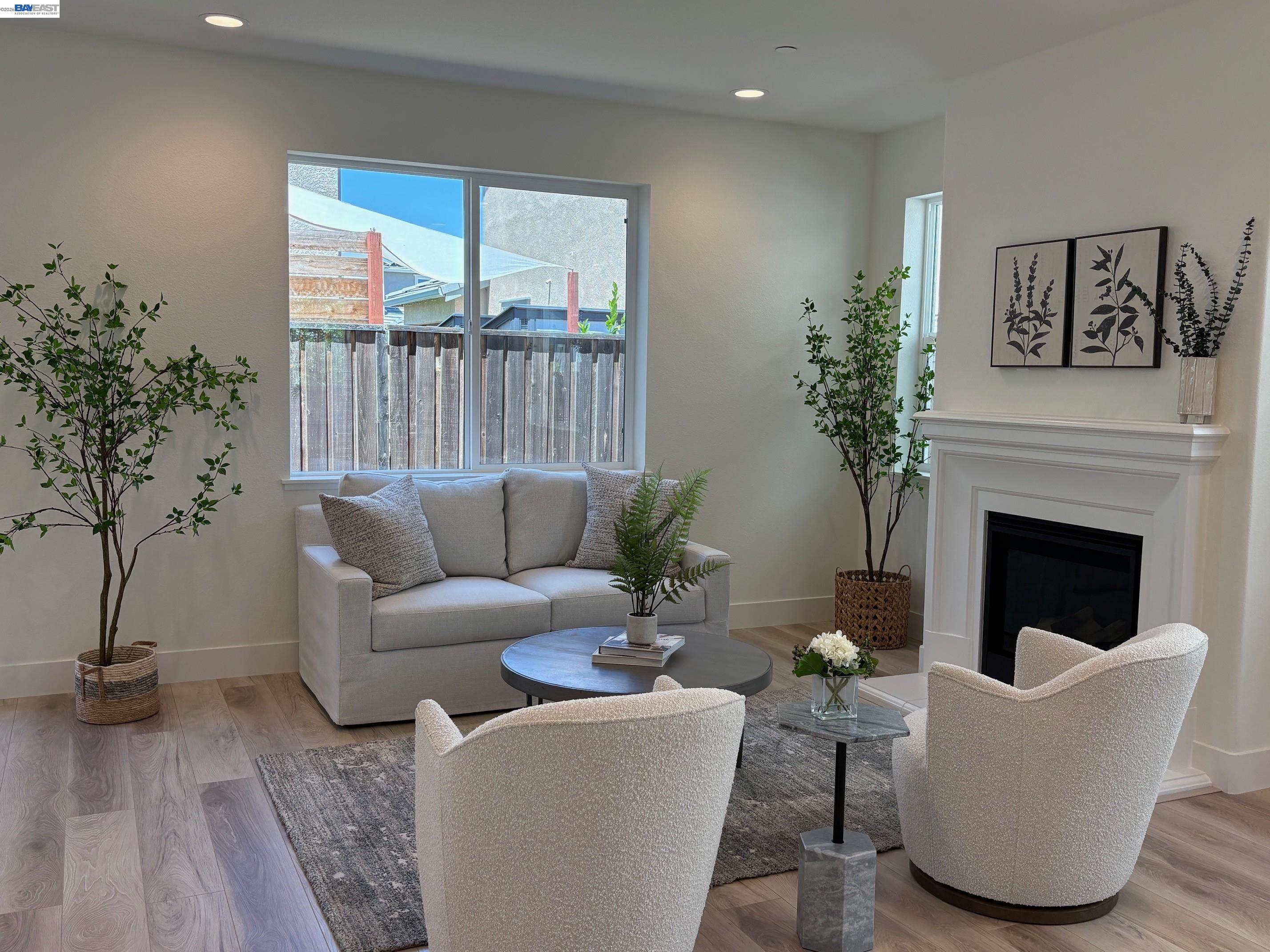 1476 Monument Lane Fairfield, CA 94533 - Photo 9 of 24 a living room with furniture a potted plant and a fireplace