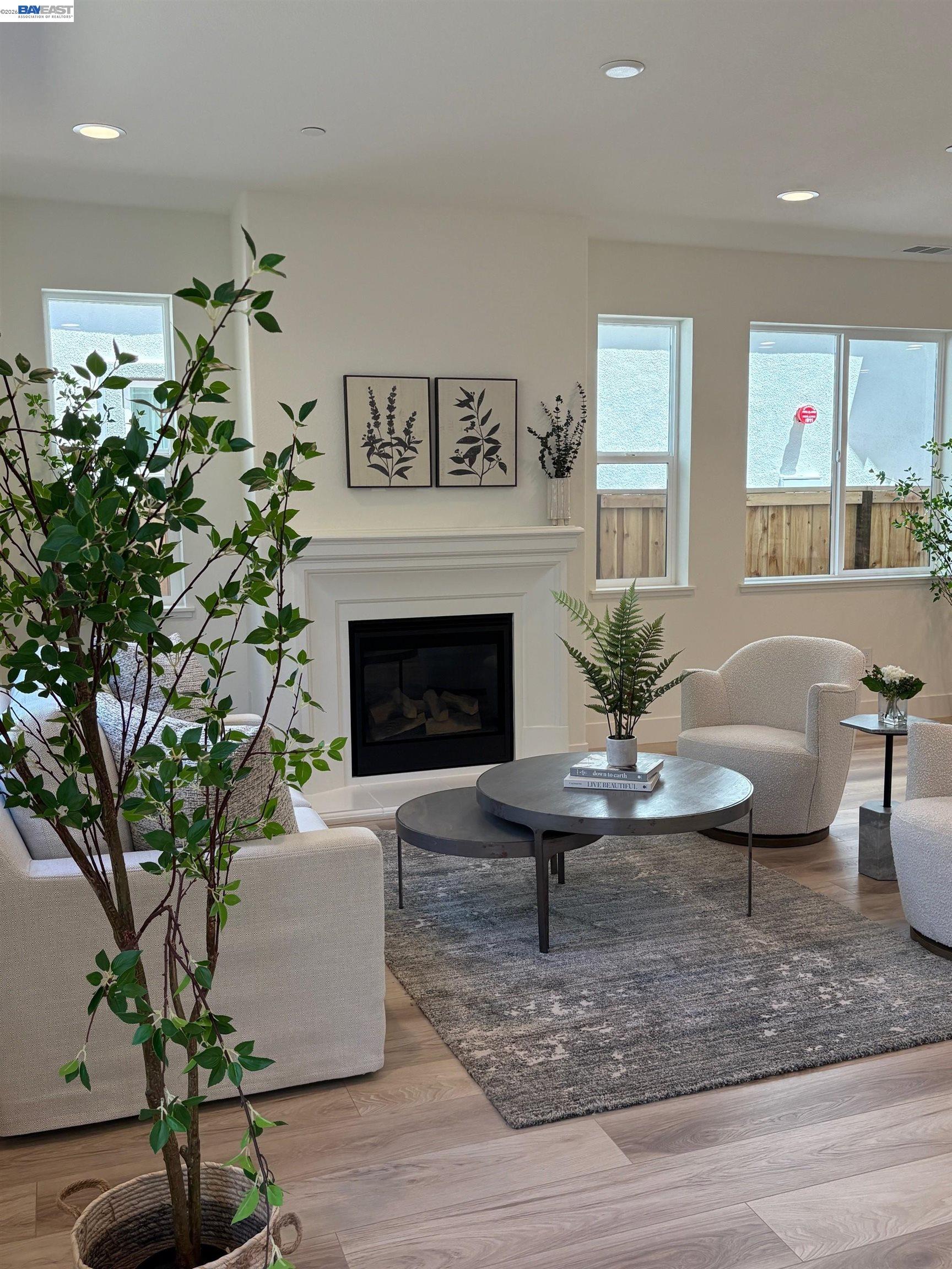 1476 Monument Lane Fairfield, CA 94533 - Photo 10 of 24 a living room with furniture potted plant and a fireplace