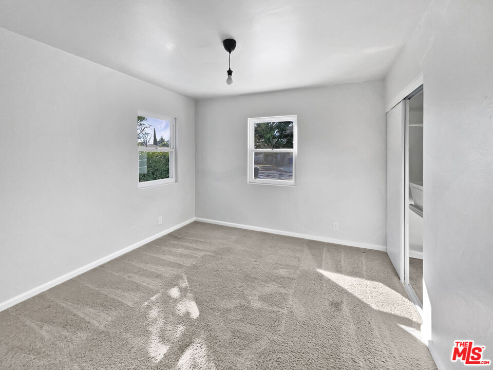 6906 Balcom Avenue Reseda, CA 91335 - Photo 14 of 19 a view of an empty room with a window