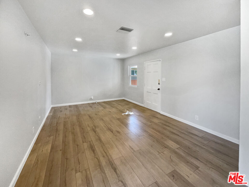 6906 Balcom Avenue Reseda, CA 91335 - Photo 3 of 19 a view of empty room with wooden floor