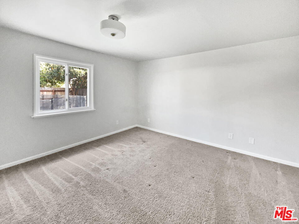 6906 Balcom Avenue Reseda, CA 91335 - Photo 5 of 19 an empty room with a window