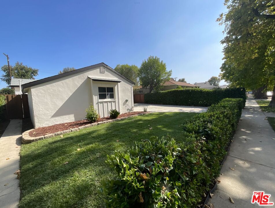 6906 Balcom Avenue Reseda, CA 91335 - Photo 10 of 19 a front view of a house with garden