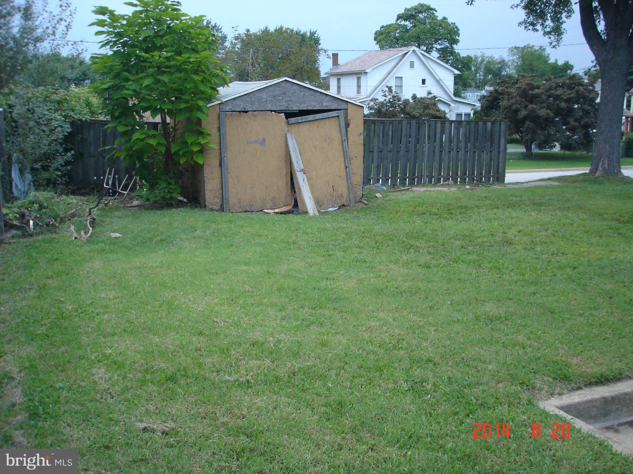 1828 Marshall Road Dundalk, MD 21222 - Photo 5 of 5 a view of backyard with small cabin and wooden fence