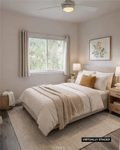 a bedroom with a bed and window