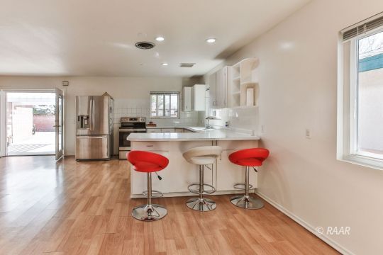 120 South Silver Ridge Street Ridgecrest, CA 93555 - Photo 13 of 35 a kitchen with stainless steel appliances granite countertop a refrigerator and a sink