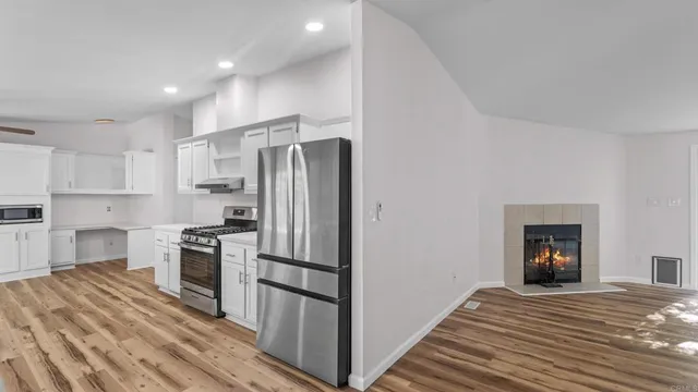 a view of a kitchen from the hallway