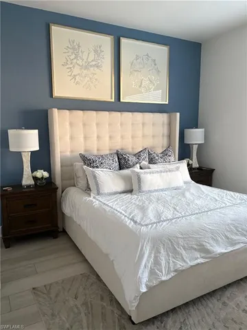 a bedroom with bed and window