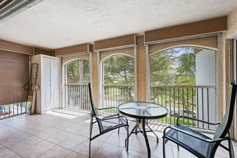 a view of a room with furniture and a porch
