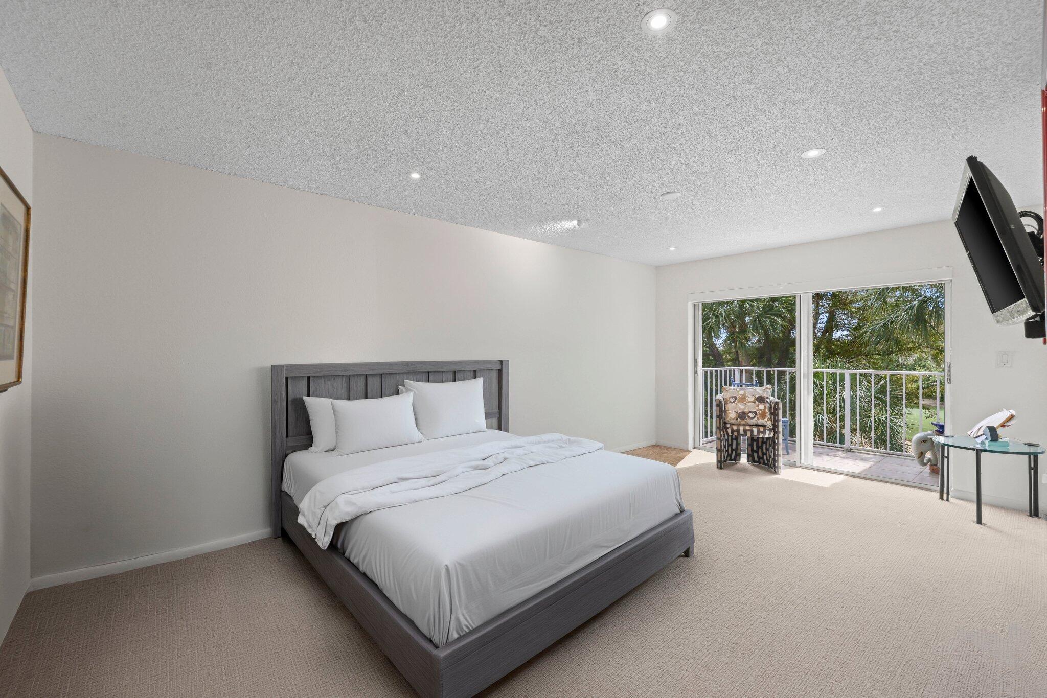 7370 Orangewood Lane, Unit 302 Boca Raton, FL 33433 - Photo 22 of 38 Primary Suite with Staged Bed