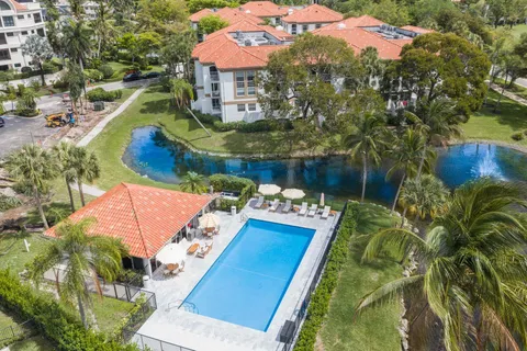 swimming pool view with a seating space