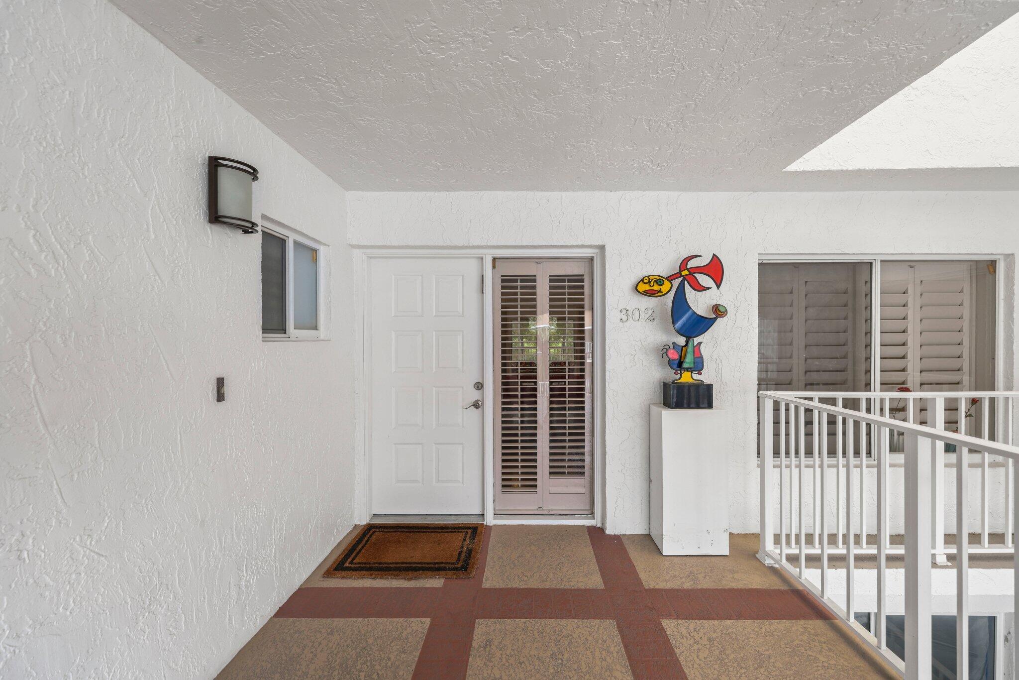 7370 Orangewood Lane, Unit 302 Boca Raton, FL 33433 - Photo 6 of 38 Walkway to front door