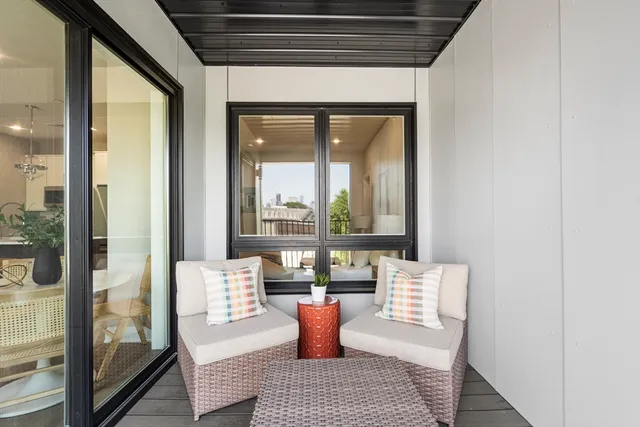 a living room with furniture and a window