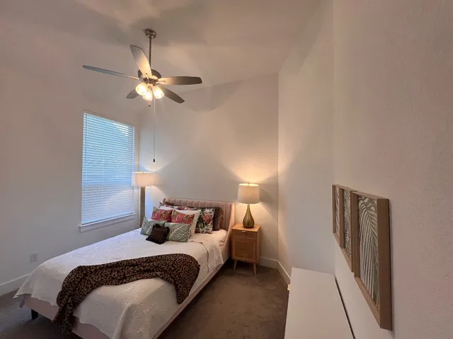 a kitchen with stainless steel appliances a sink and a refrigerator
