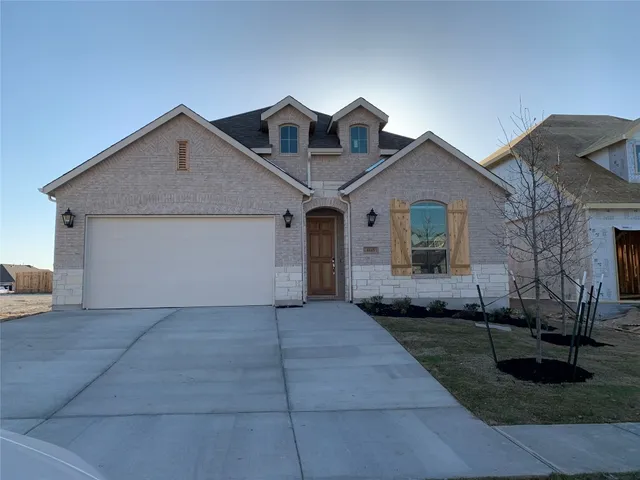 a living room with lots of furniture a dining table and kitchen view