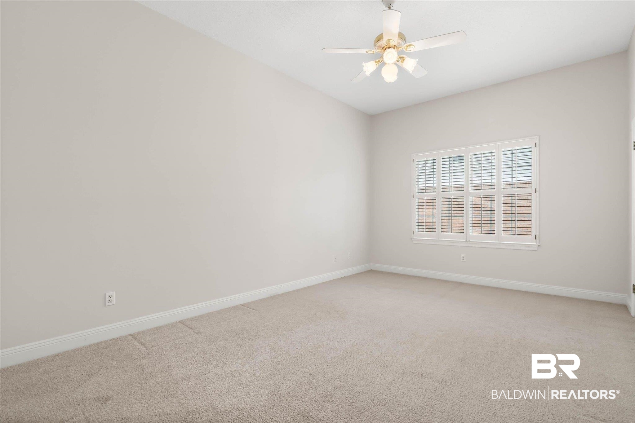 1083 Southern Way Court Mobile, AL 36609 - Photo 23 of 31 Empty room featuring light carpet and a ceiling fan