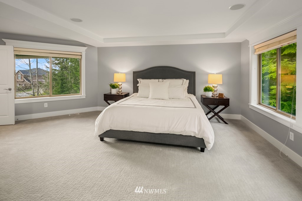 2989 Northeast Davis Loop Issaquah, WA 98029 - Photo 24 of 37 a spacious bedroom with a bed and a large window