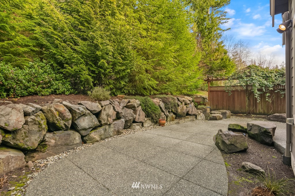 2989 Northeast Davis Loop Issaquah, WA 98029 - Photo 35 of 37 a view of a backyard with couches and a fire pit