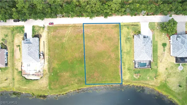 a view of a swimming pool with a yard