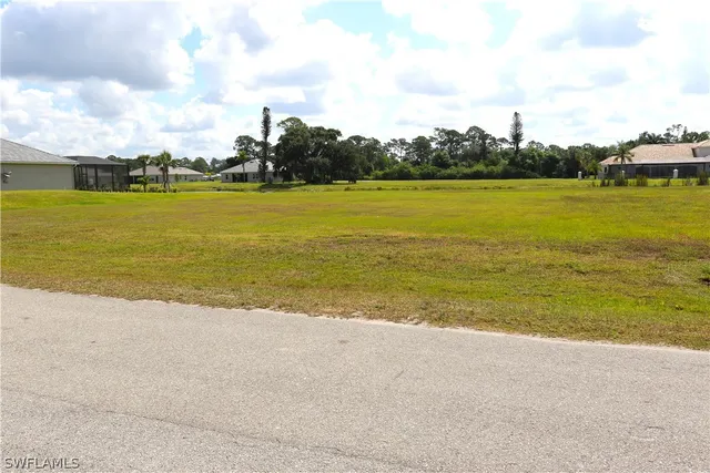 a view of swimming pool with a garden and seating area
