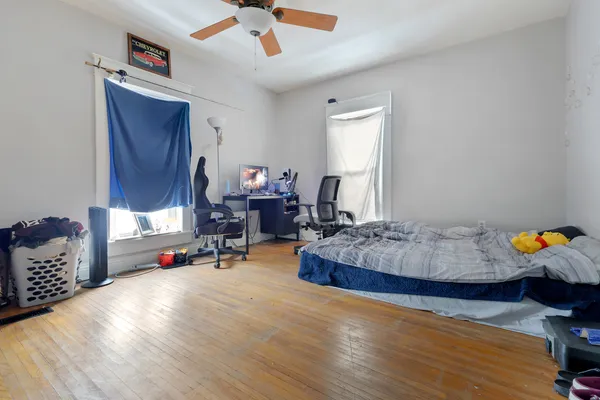 a bedroom with bed and a window