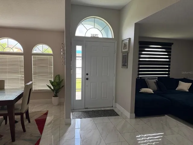 a view of livingroom with furniture and window