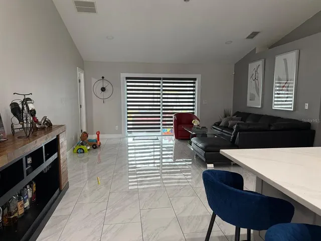 a kitchen with a stove a sink and a refrigerator