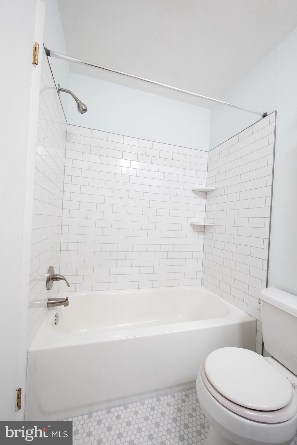 129 South Main Street, Unit A New Hope, PA 18938 - Photo 6 of 8 a bathroom with a shower a toilet and a bathtub