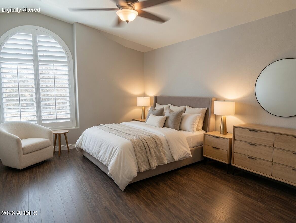 4409 East Dry Creek Road Phoenix, AZ 85044 - Photo 16 of 34 a spacious bedroom with a bed and a couch