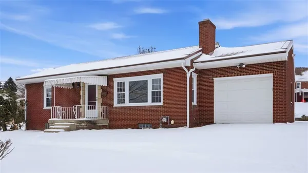 a front view of a house with a outdoor space