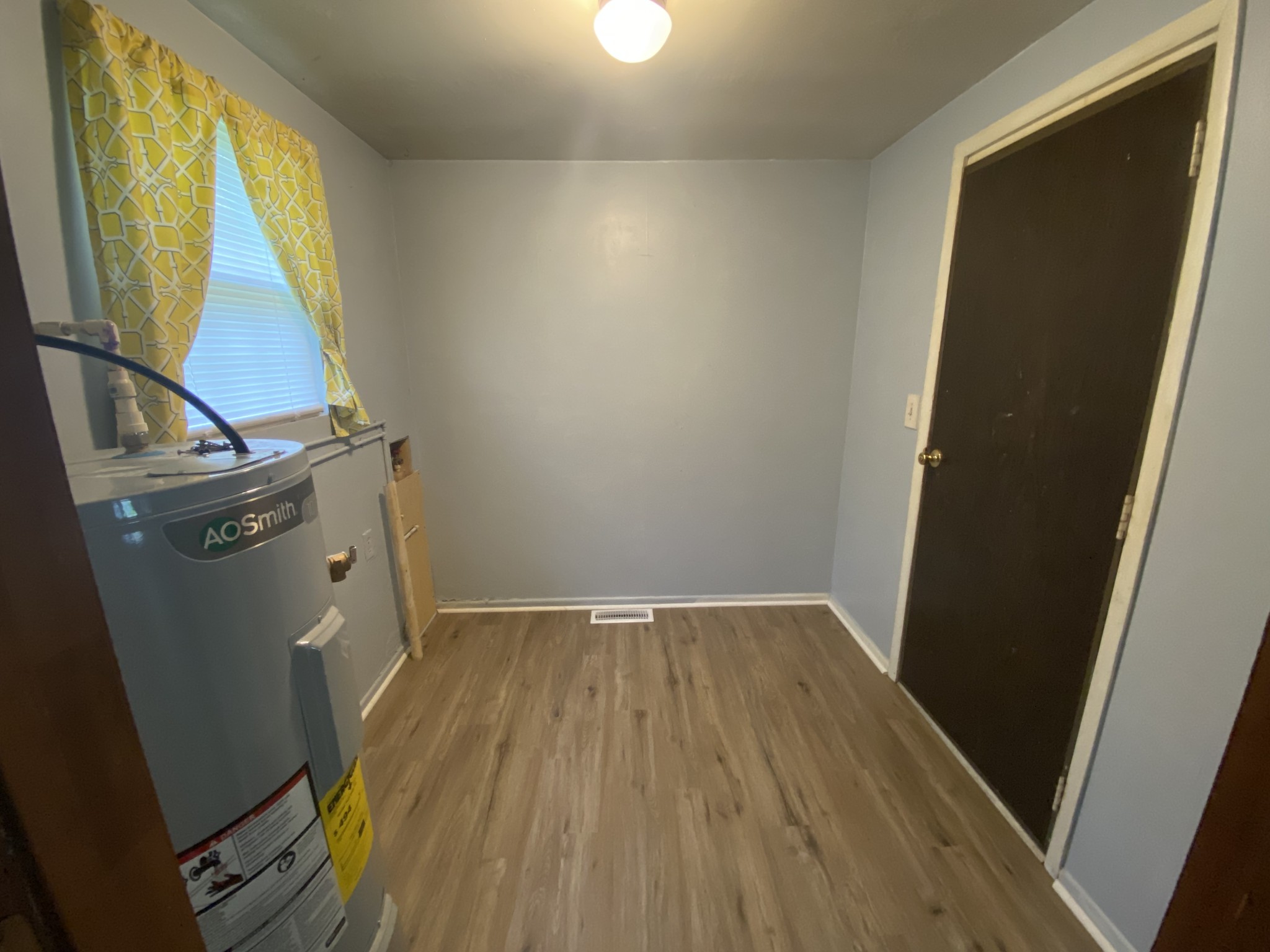 4029 Prospect Elkton Road Prospect, TN 38477 - Photo 7 of 21 an empty room with wooden floor and windows