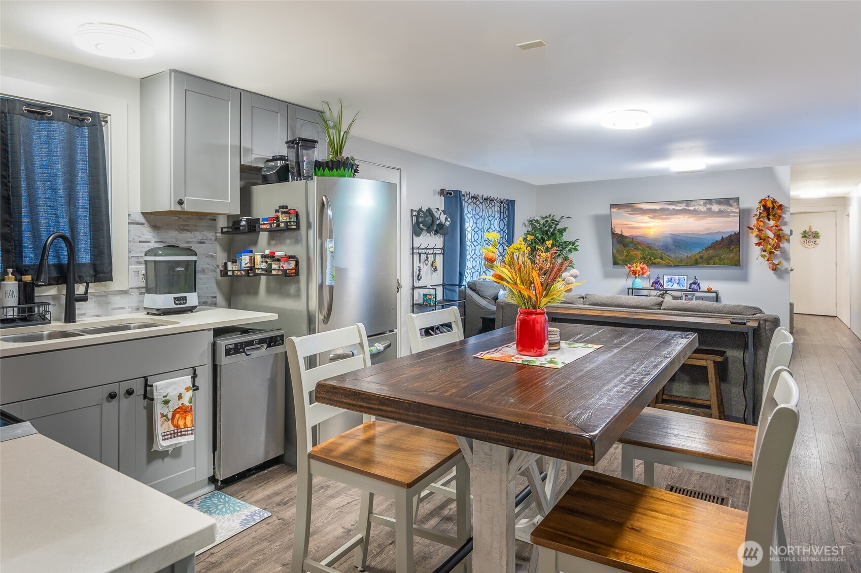 16405 Maple Valley Highway, Unit 22 Renton, WA 98058 - Photo 12 of 31 a kitchen with stainless steel appliances dining table and chairs