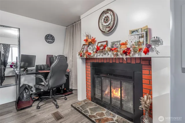 a view of a livingroom with furniture and a fireplace