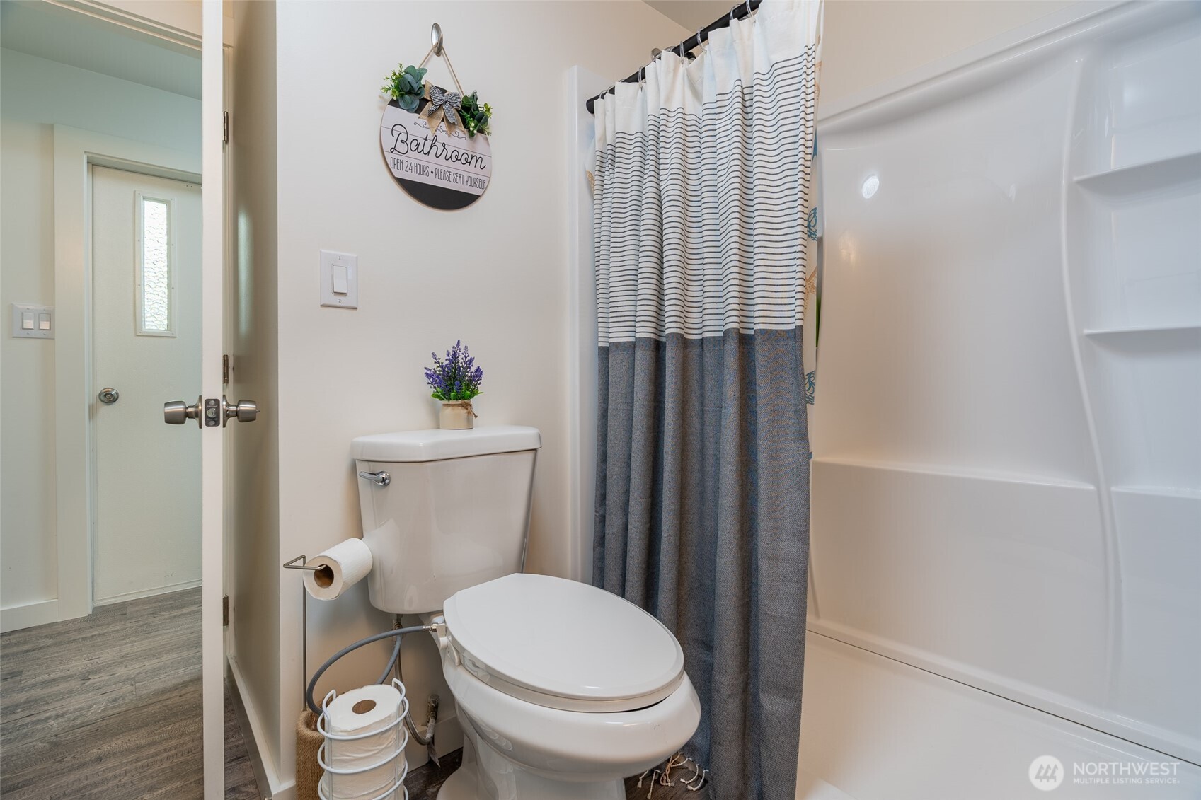 16405 Maple Valley Highway, Unit 22 Renton, WA 98058 - Photo 19 of 31 a bathroom with a toilet a sink and tub