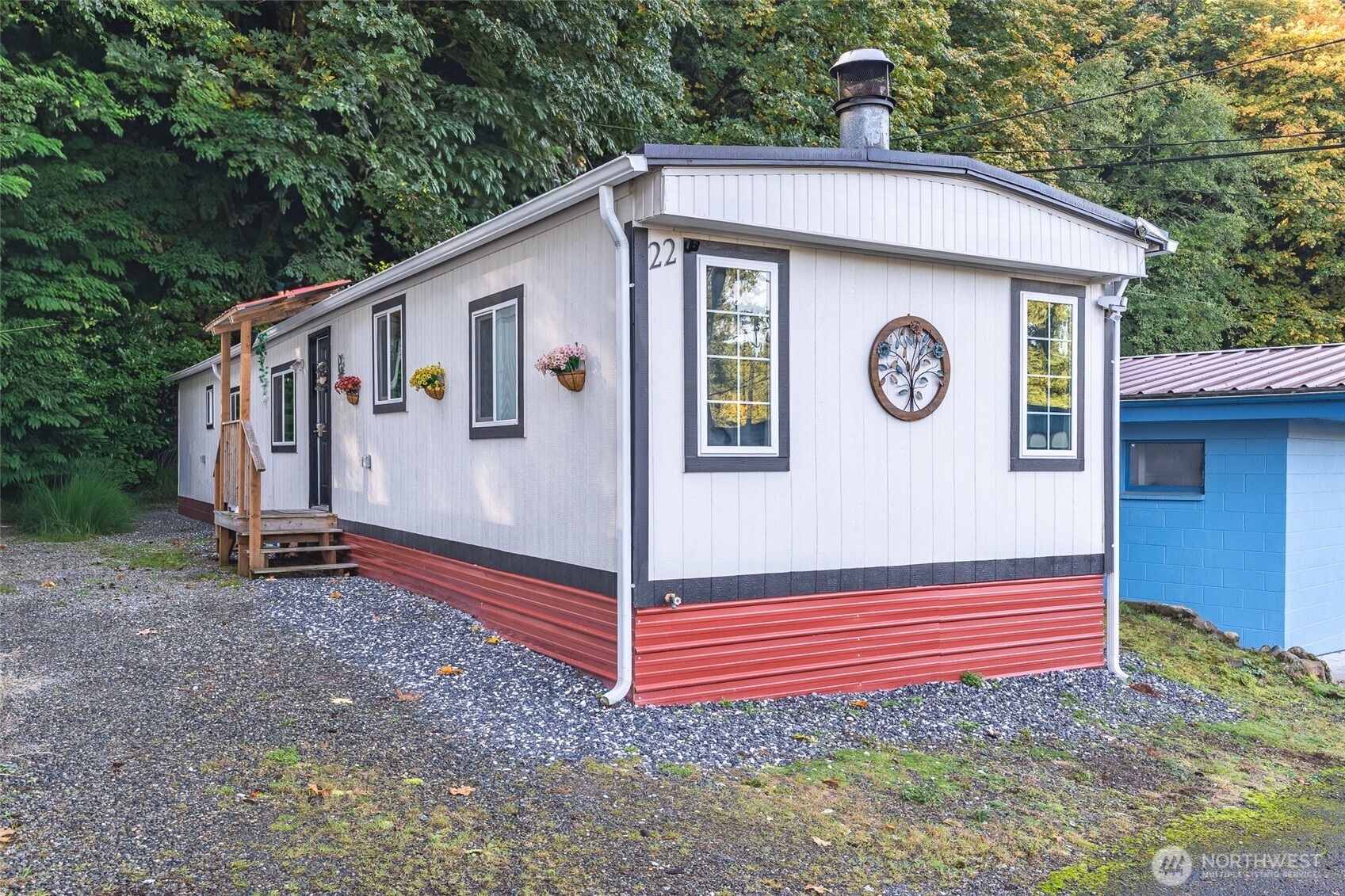 16405 Maple Valley Highway, Unit 22 Renton, WA 98058 - Photo 2 of 31 a view of a house with a yard