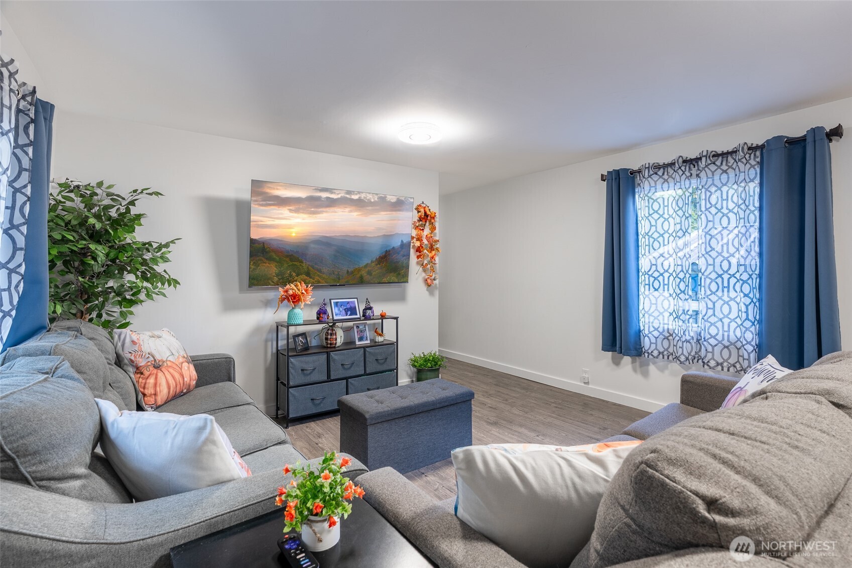 16405 Maple Valley Highway, Unit 22 Renton, WA 98058 - Photo 6 of 31 a living room with furniture and a flat screen tv