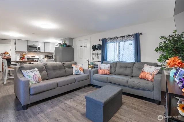 a living room with furniture and a large window