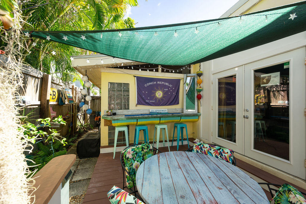 905 Grinnell Street Key West, FL 33040 - Photo 15 of 19 a view of a chairs and table in the balcony