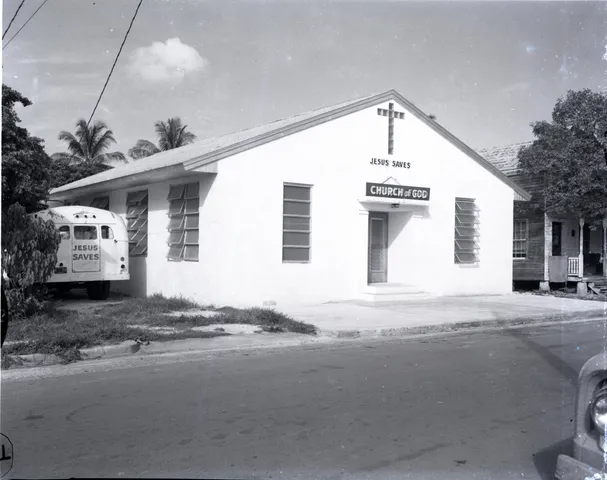 a front view of a house with a road