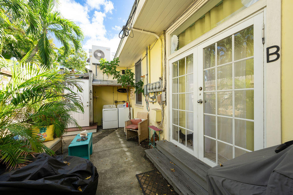 905 Grinnell Street Key West, FL 33040 - Photo 8 of 19 a view of a porch with plants and a yard