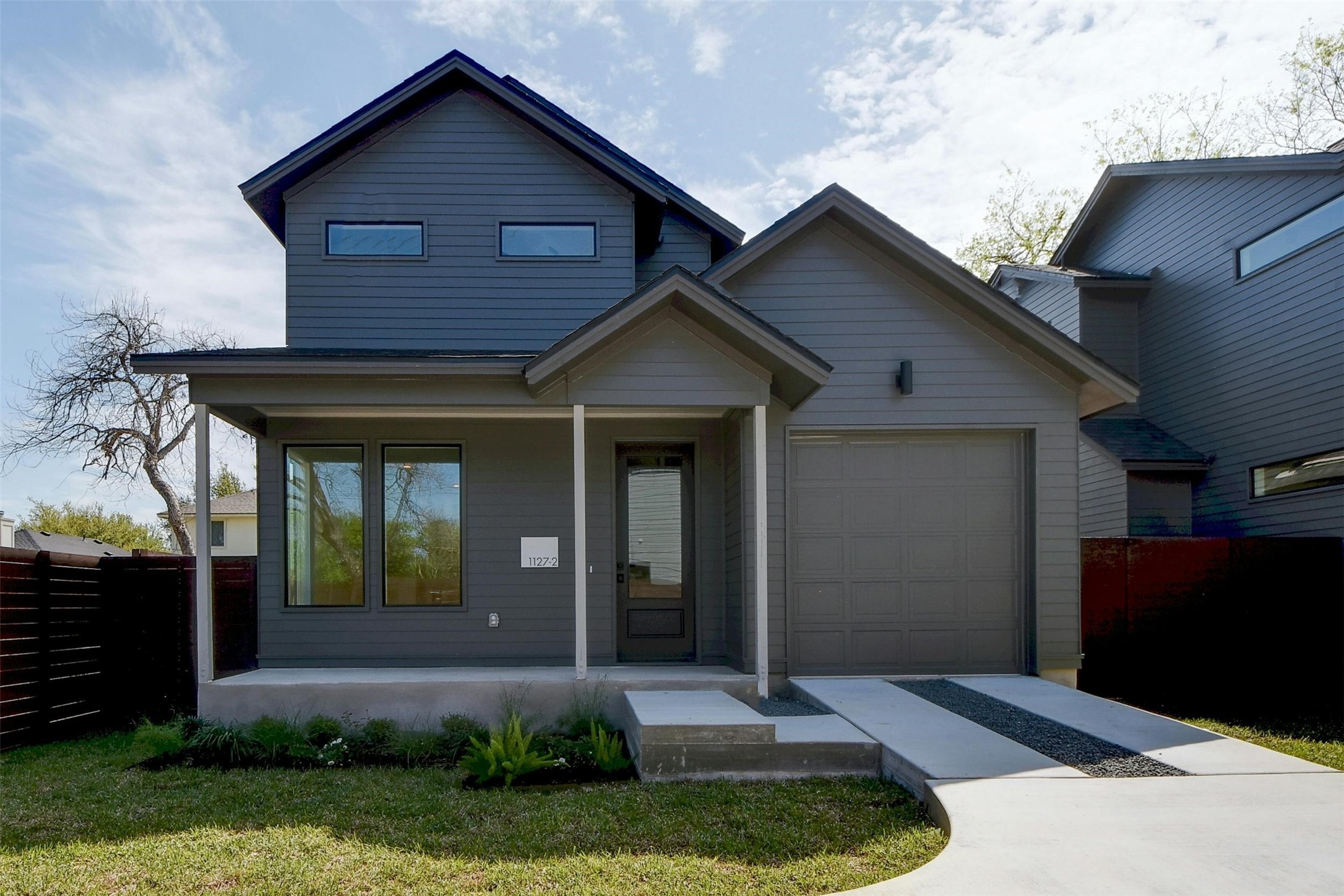 1127 Walton Lane, Unit 2 Austin, TX 78721 - Photo 1 of 1 a front view of a house with garden