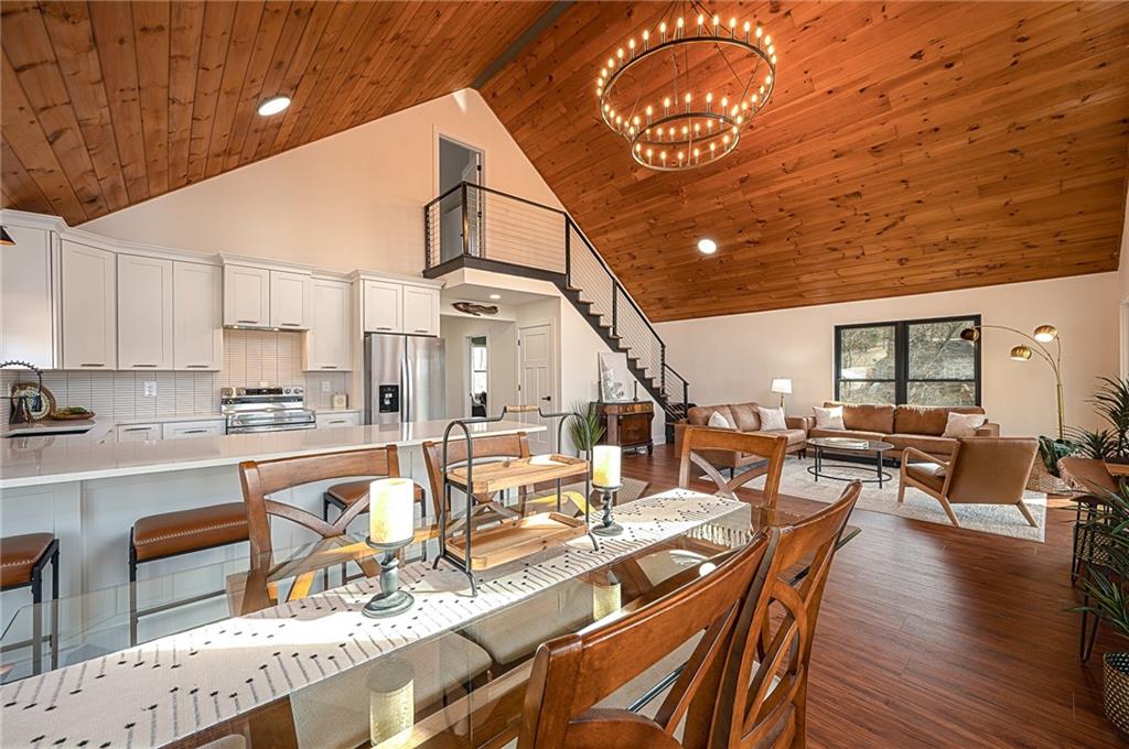 3339 Cove Overlook Road Gainesville, GA 30501 - Photo 14 of 67 a large kitchen with lots of counter top space and dining table