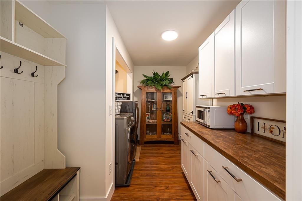3339 Cove Overlook Road Gainesville, GA 30501 - Photo 16 of 67 a kitchen with stainless steel appliances granite countertop a refrigerator a stove and a sink