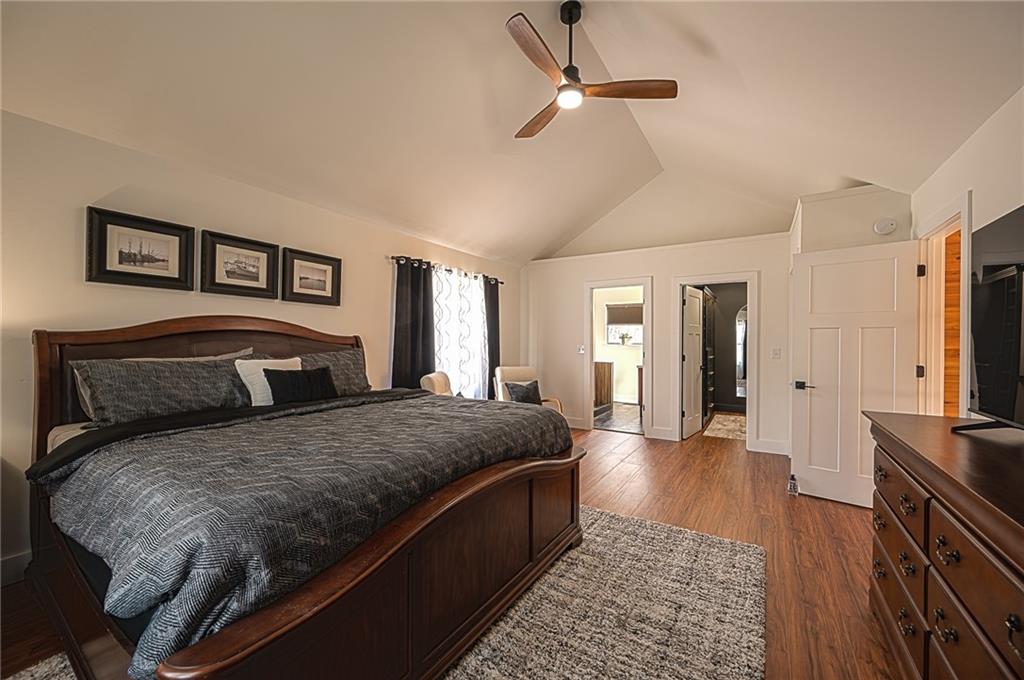 3339 Cove Overlook Road Gainesville, GA 30501 - Photo 19 of 67 a bedroom with a large bed and a flat screen tv