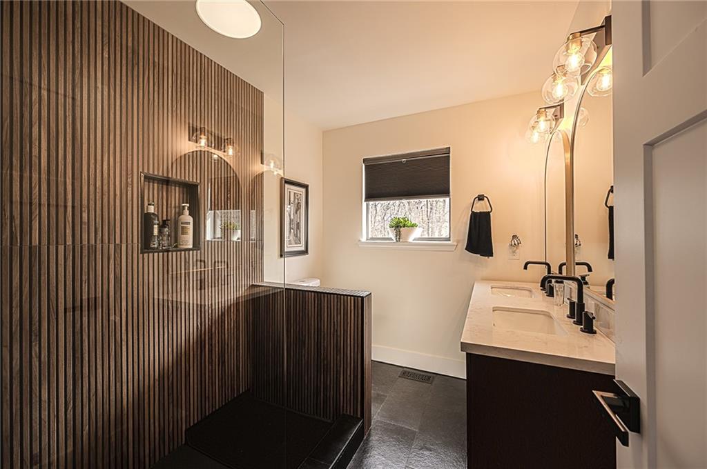 3339 Cove Overlook Road Gainesville, GA 30501 - Photo 20 of 67 a bathroom with a sink and mirror