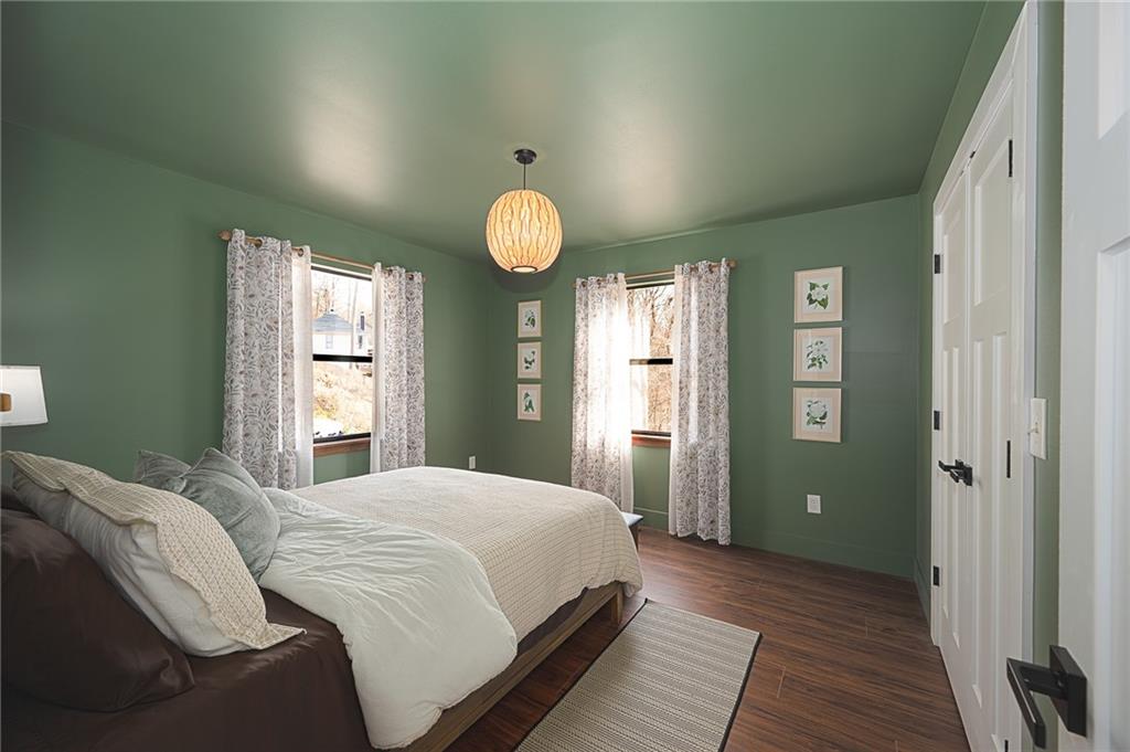 3339 Cove Overlook Road Gainesville, GA 30501 - Photo 24 of 67 a bedroom with a bed and painting on the wall