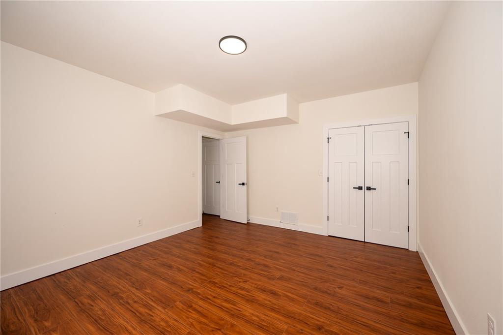 3339 Cove Overlook Road Gainesville, GA 30501 - Photo 36 of 67 a view of an empty room with wooden floor
